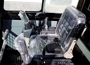 Mini excavator hydraulic controls and track system